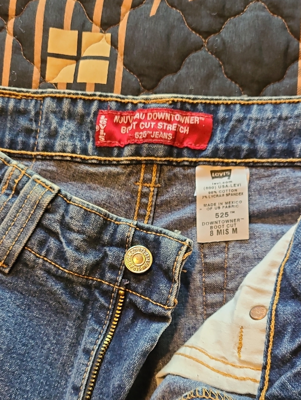 Levi's Nouveau blue denim boot cut jeans with gold stitching